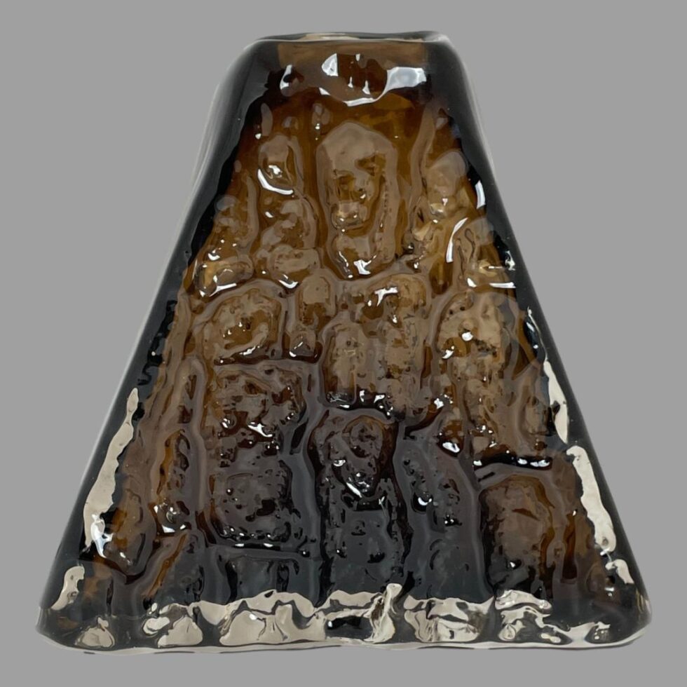 Main photo of Whitefriars pyramid bark vase seen lengthways with the 'volcano' shape in full view. The glass has a lovely bark like texture hence the name with smooth glass to the sides and base. Warm brown cinnamon colour adds another dimension to the volcano theme.