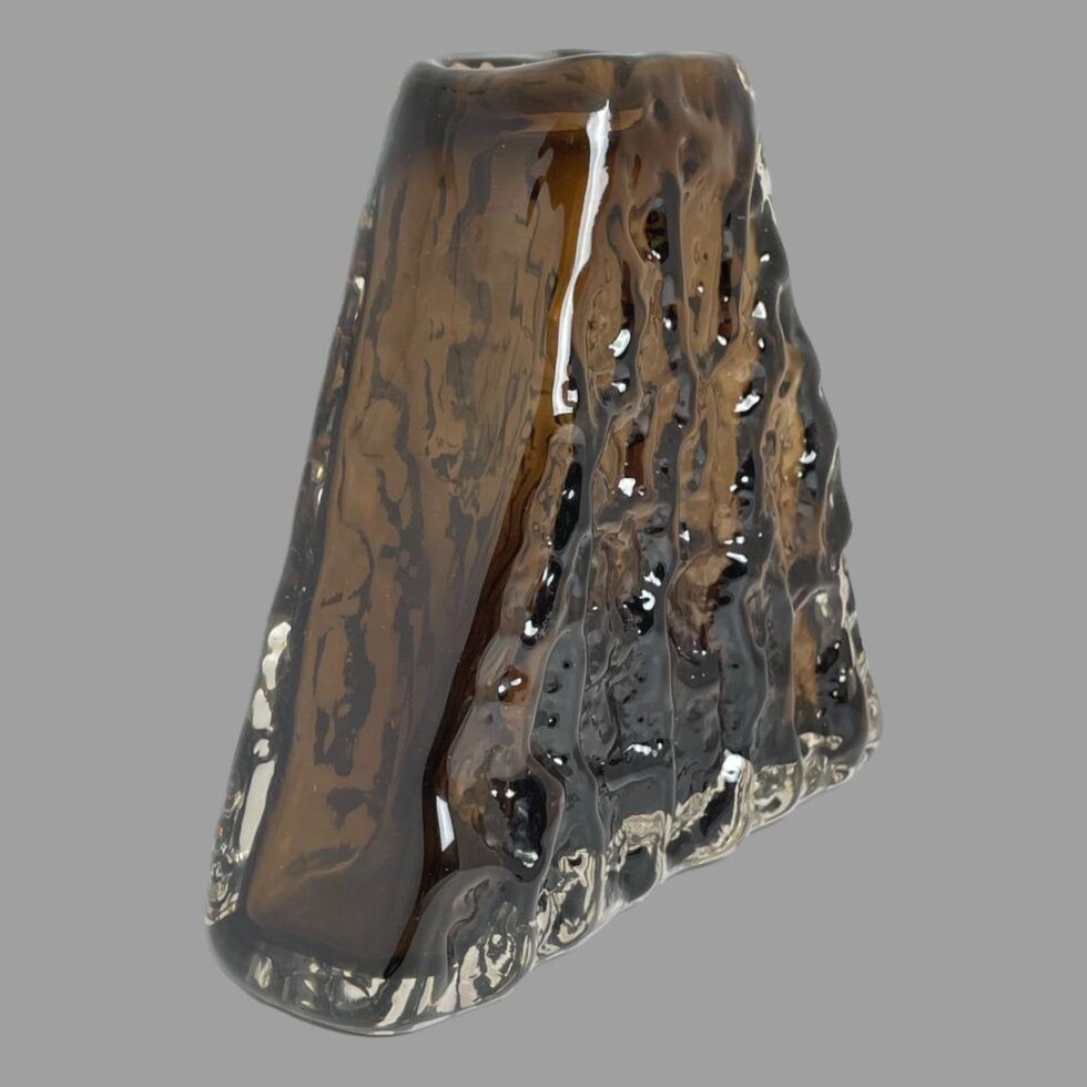 Photo of Whitefriars pyramid bark vase seen from a diagonal side angle with one wide bark side facing the bottom right and smooth thinner depth side in the bottom left.