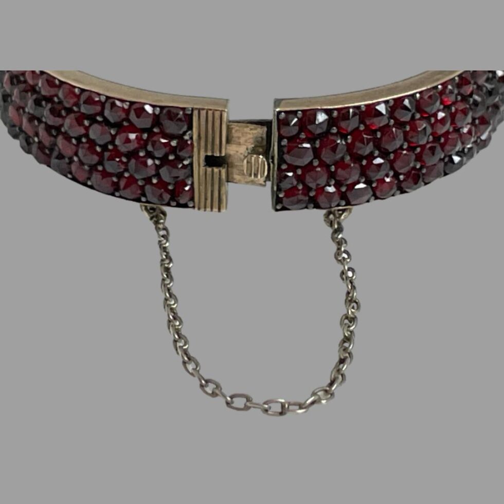 Close up photo of the clasp area of bracelet seen with clasp undone but not completely out.