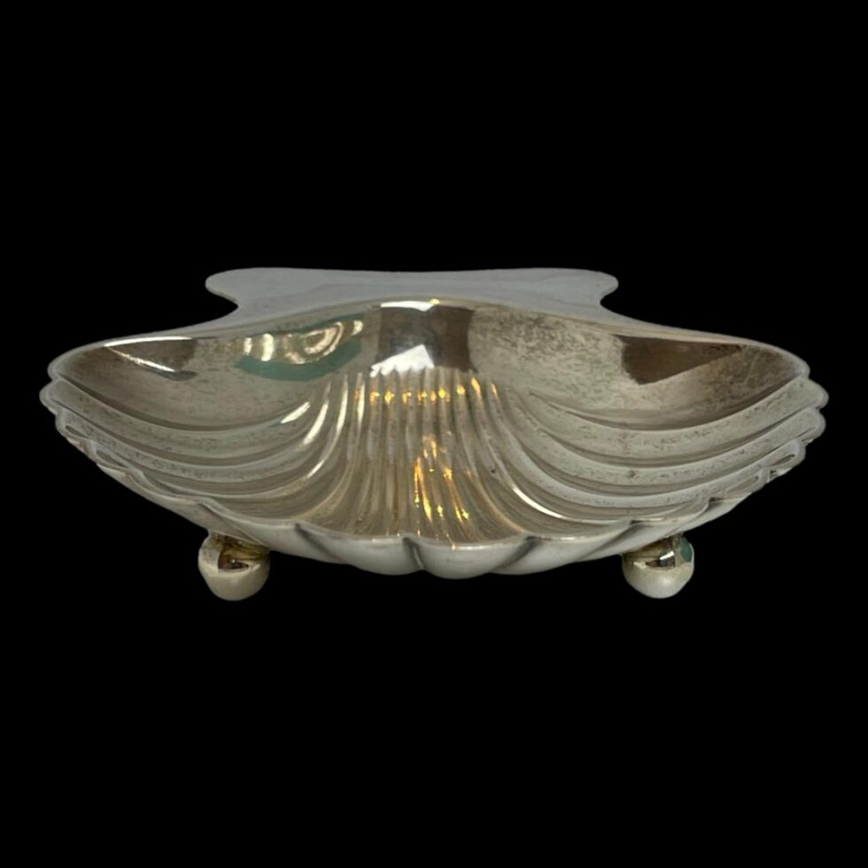 Photo of dish seen from an eye level with the front of dish in the centre foreground and the 2 ball feet visible.