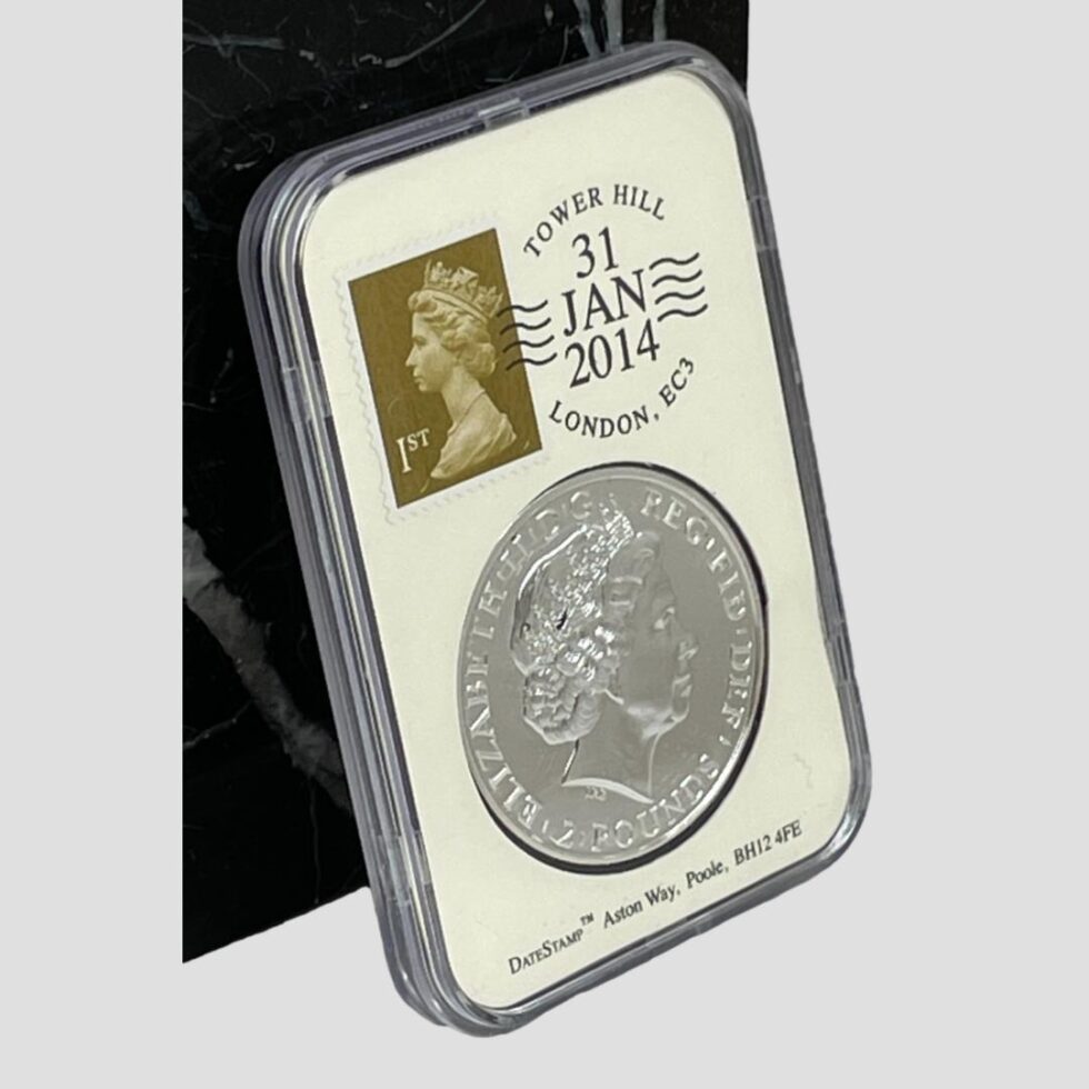 Photo of silver year of the horse date stamp commemoration from a slightly raised and side angle.