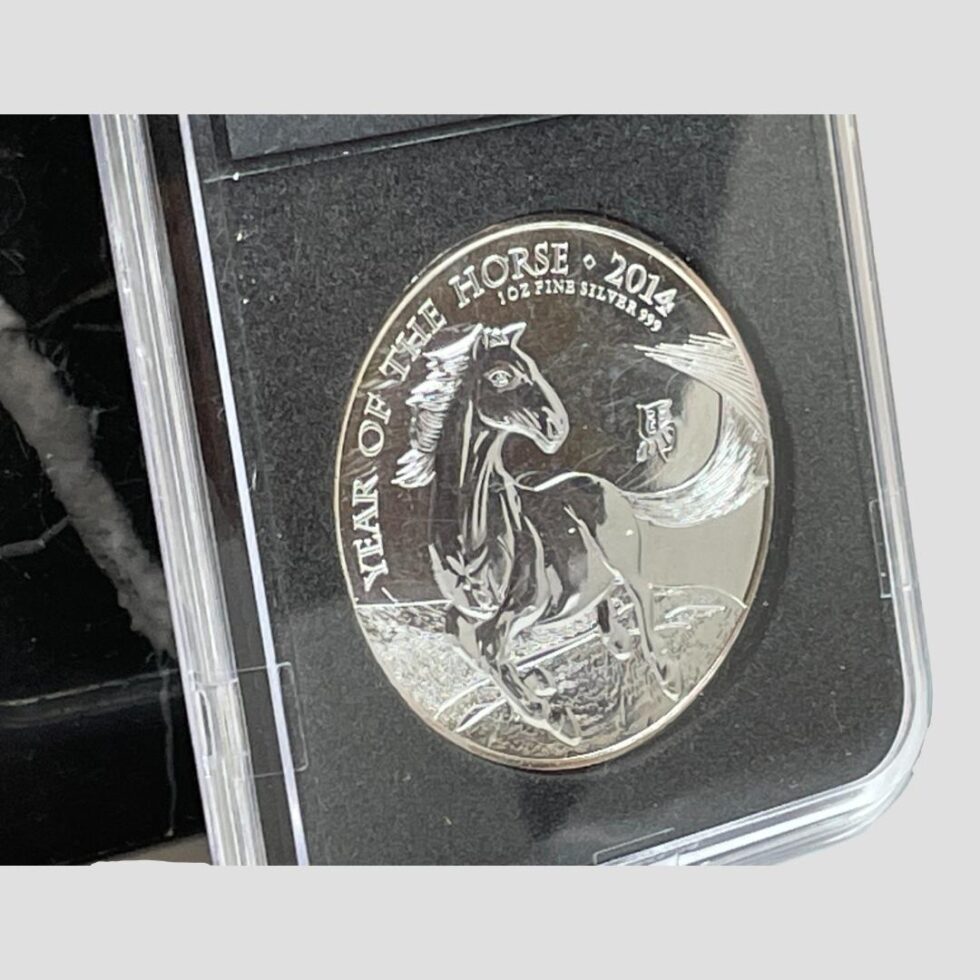 A close up of the horse side of coin from a slight side angle.