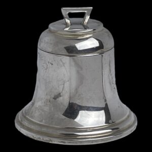 Min photo of antique silver bell inkwell seen with top closed and with the front opening side in the foreground. There is a little arch shaped handle to the top for opening.