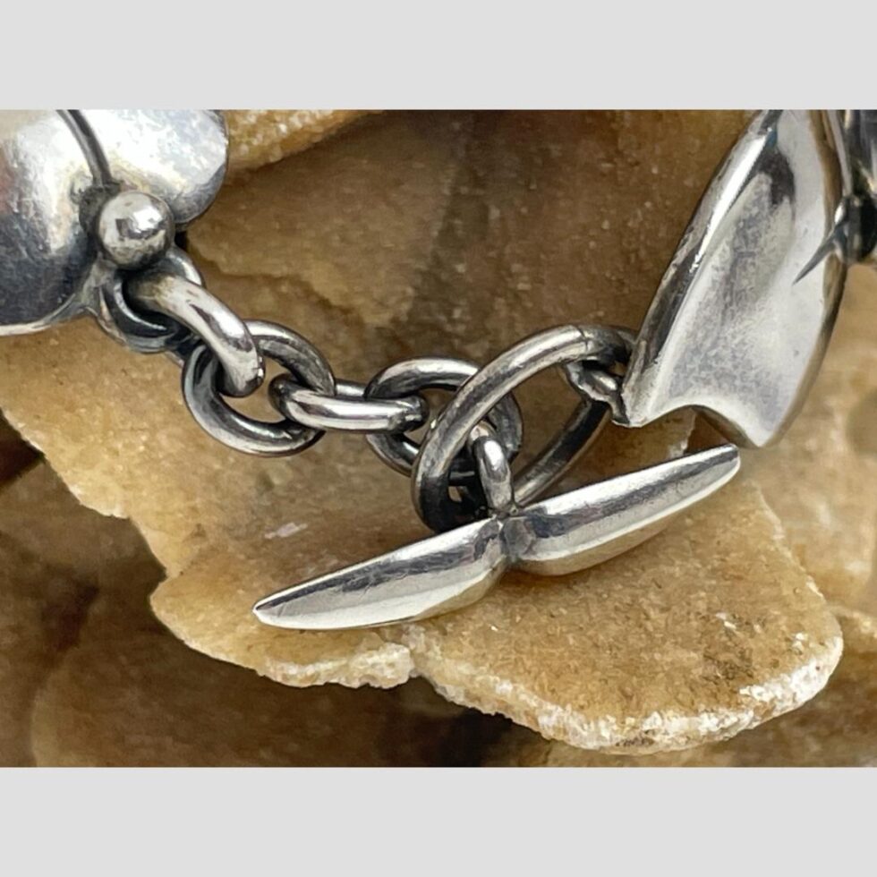 A close up photo of the wonderful whale tail toggle clasp.