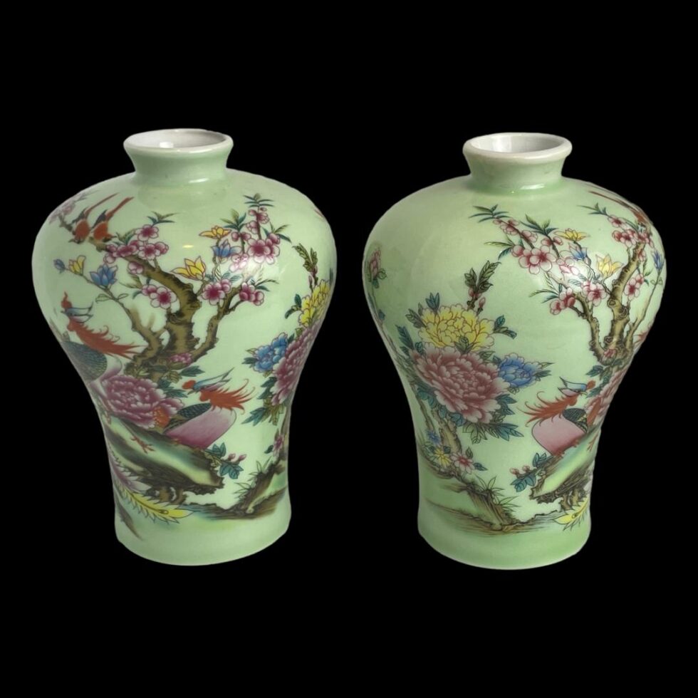 Photo of vases still displayed side by side against a black background this time with a different area of the decoration on show. There are peony flowers and blossoms on the tree.