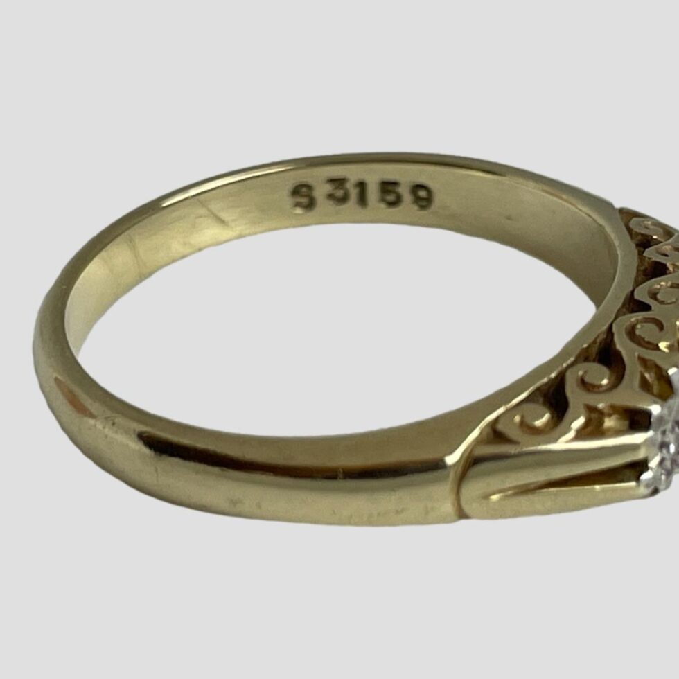 A close up photo of the assumed patent or design number stamped on the opposite side of the hallmark on inside band. S3159.
