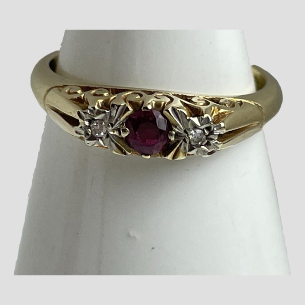 Photo of ring displayed on a cone shaped stand with the ring front forward facing showing the fine details of the ring front and gallery.