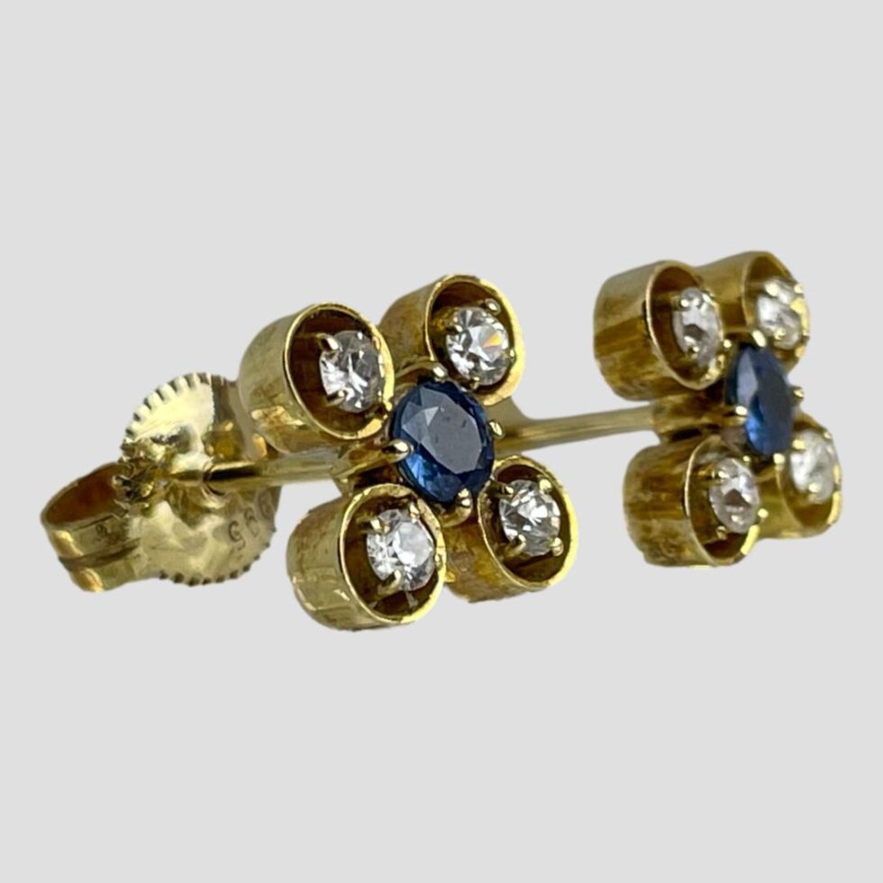 Photo of both earrings shown side by side against a light grey background. The earring fronts are facing right.