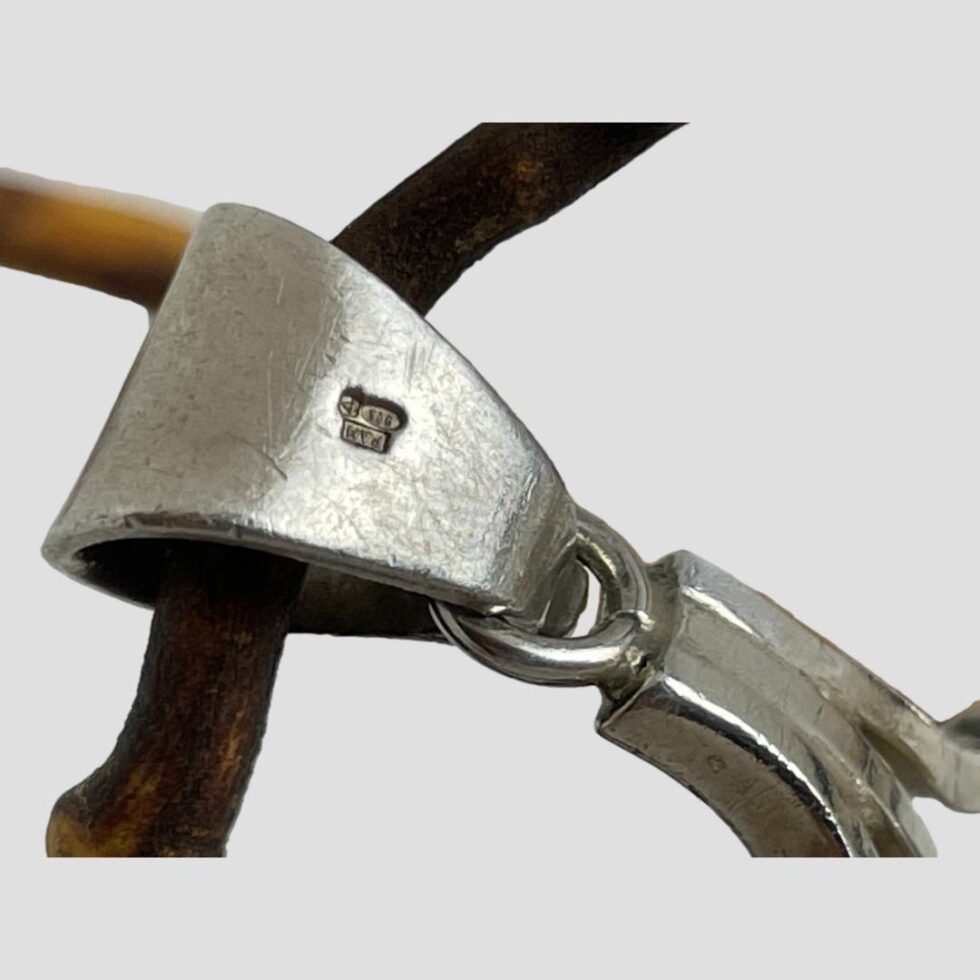 Close up photo of the hallmark on the back of the solid closed bail.