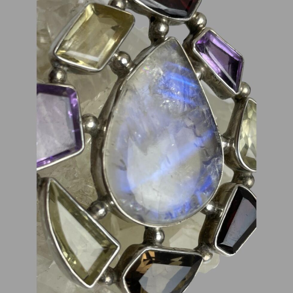 Close up photo of the beautiful blue streaks inside the moonstone.