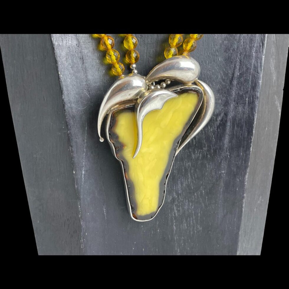 Close up photo of the large egg yolk pendant.