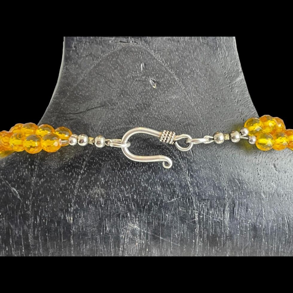 Close up photo of the silver clasp