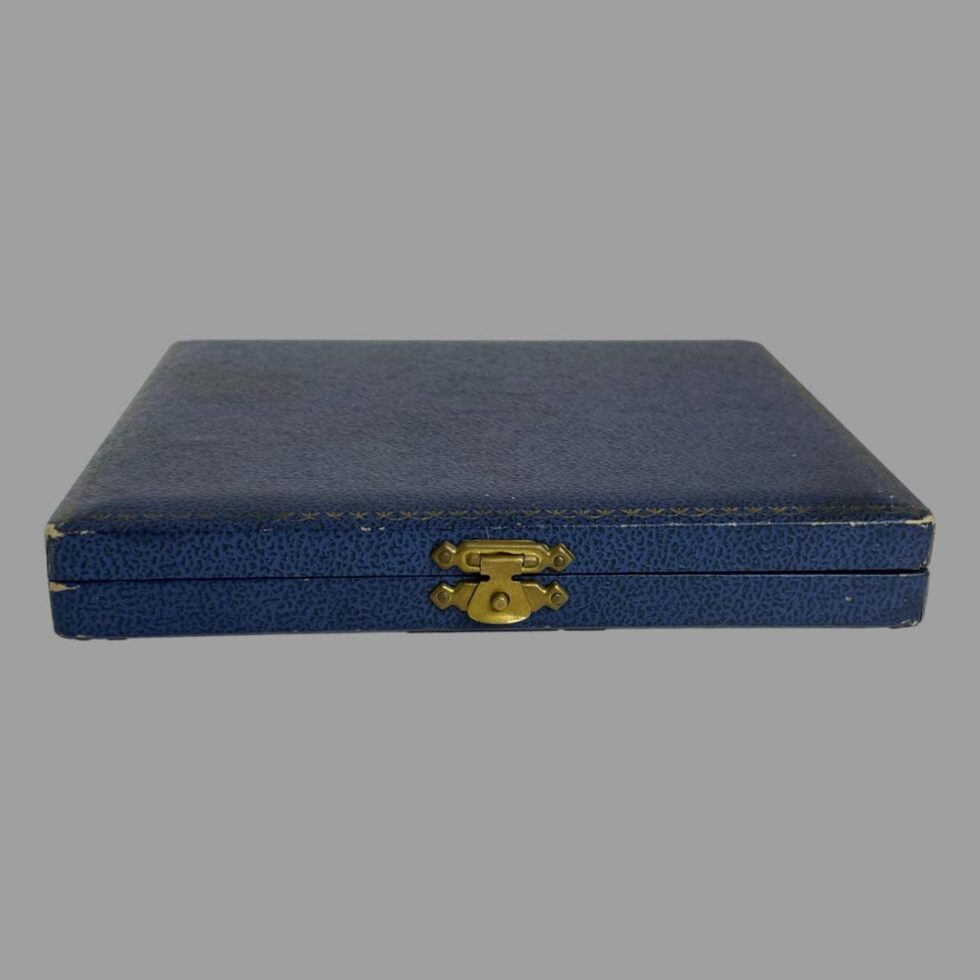 Photo of the closed box containing the silver enamel spoons.