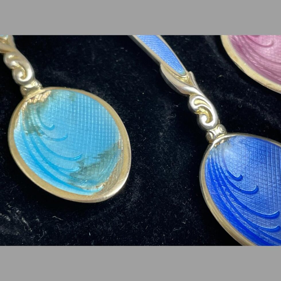 Close up photo of the bowls of the turquoise and blue showing the damage to enamel.