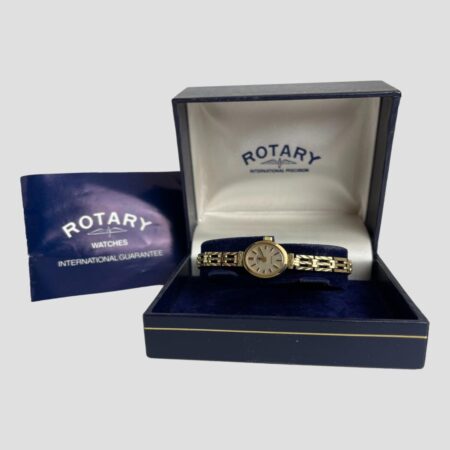 Main photo of 9kt ladies Rotary watch displayed inside its original case with the purchase of receipt document to the left of box. The watch face is oval and small so best suited for someone with good eye sight.