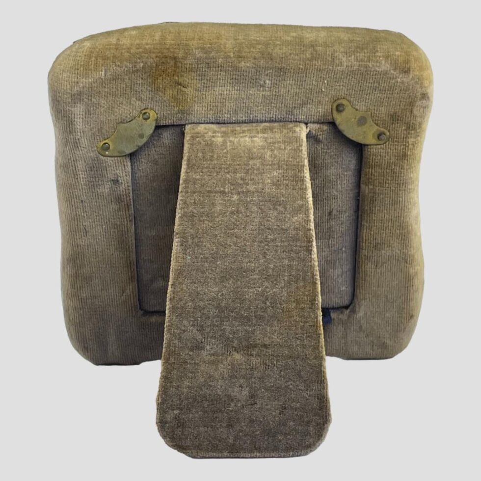 Photo of the back of the frame showing the faded velvet.