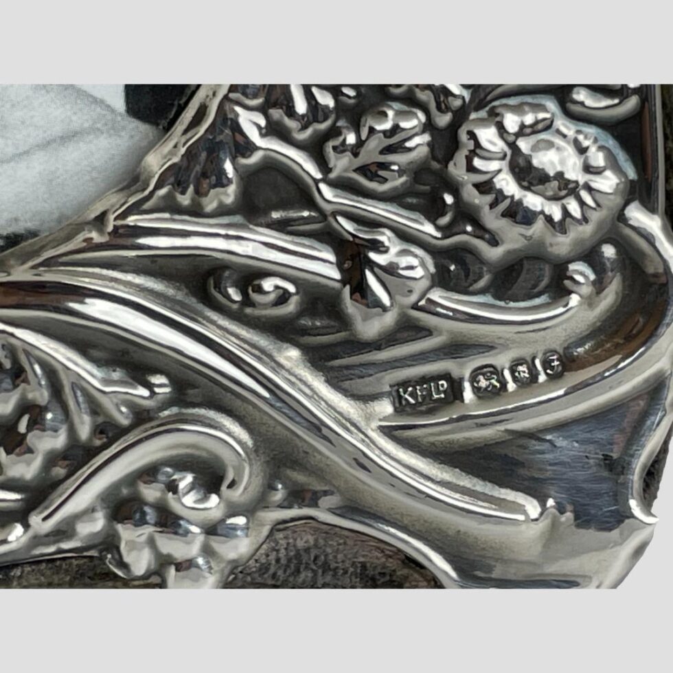 Close up photo of the full hallmark to the bottom right corner of the frame front.