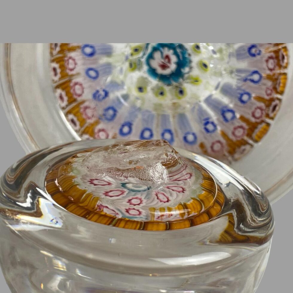 Close up photo of base of lid showing the broken off area.