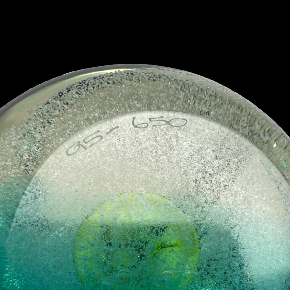 Close up photo of the numbering 95 - 650 on the paperweight base.