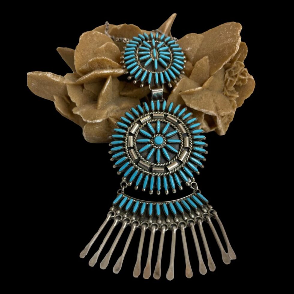 Photo of necklace only displayed propped up on the rock of natural desert sand rose. and shown forward facing.