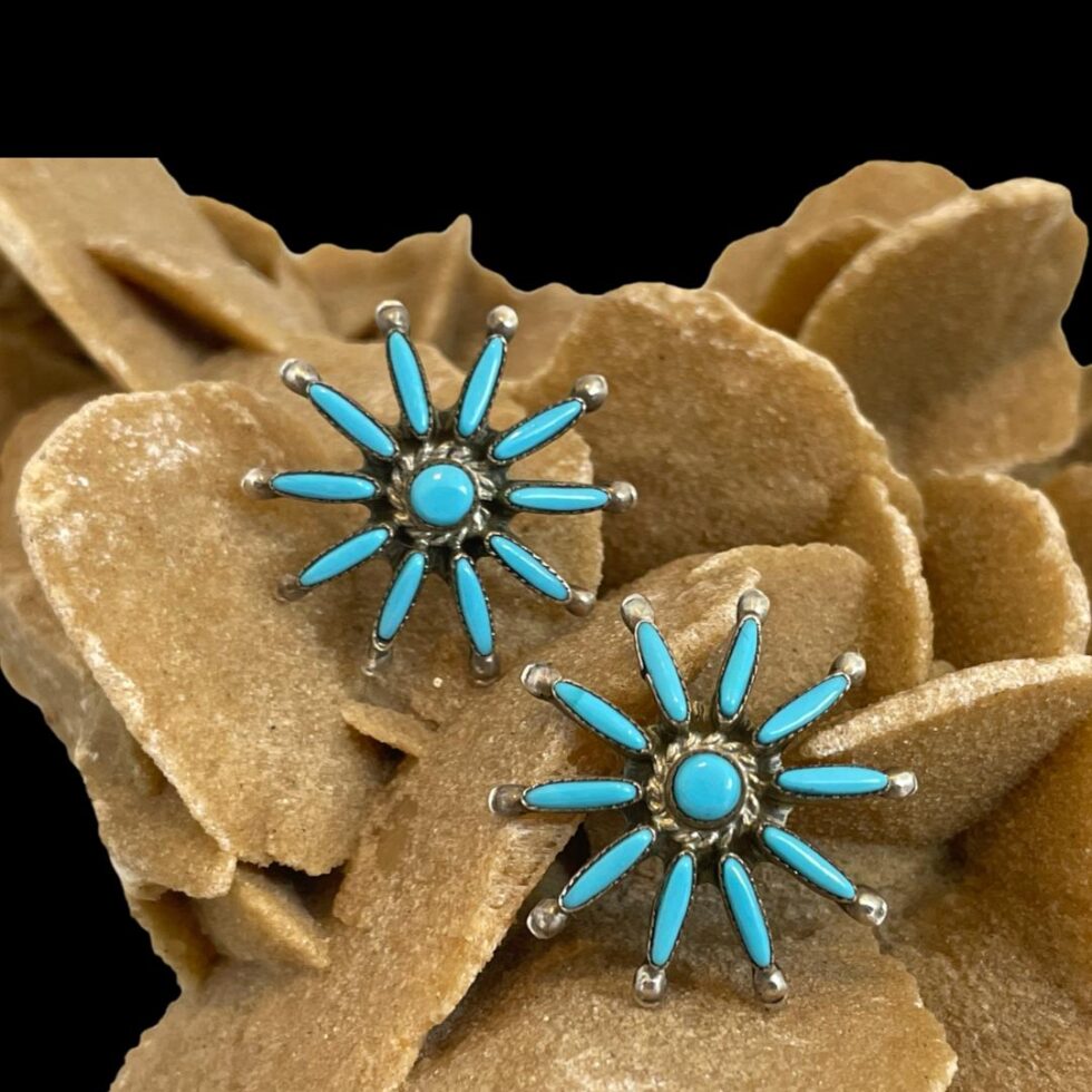 Photo of the stud earrings only displayed forward facing and on the rock of natural desert sand rose.