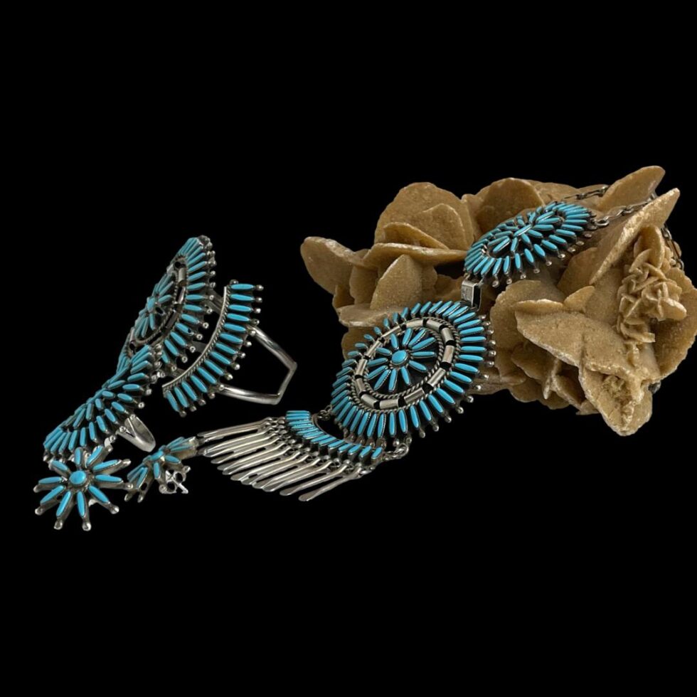 Photo of all 4 pieces of the set still displayed with a rock of natural desert sand rose as a display prop this time with the pieces all facing to the left showing the side angle and depth especially of the cuff bracelet and ring.