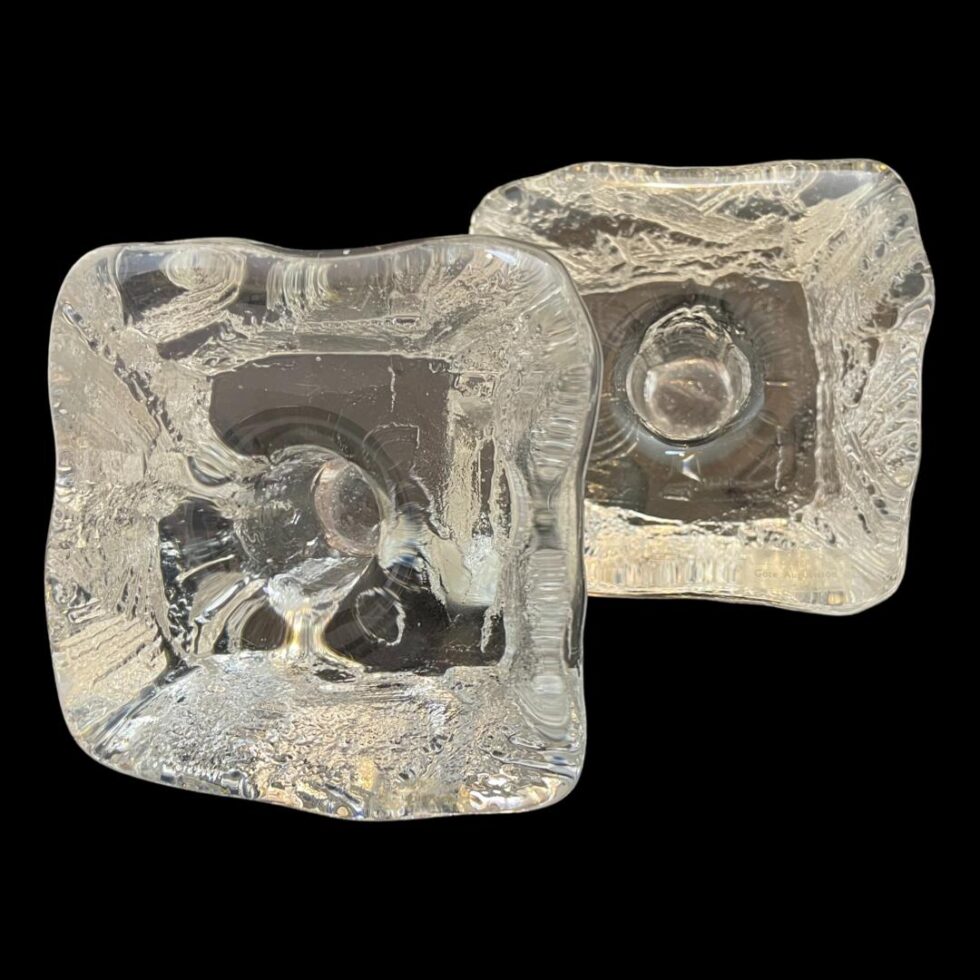 Photo of ice cube candle holders displayed upright on their sides with the top on display showing the candle slots. They are so well made to look like ice you can imagine them melting any minute!