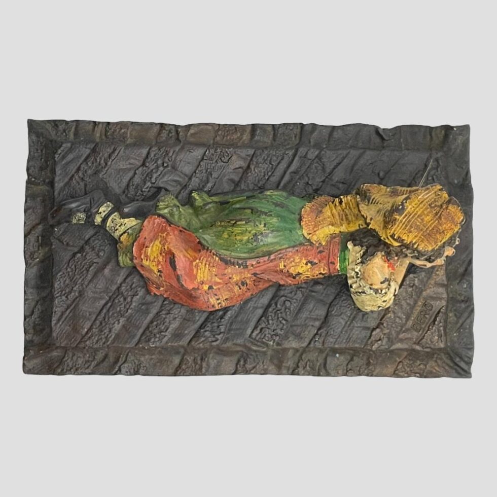 Photo looking straight down at the Bedouin girl from above. Her head is to the centre right.