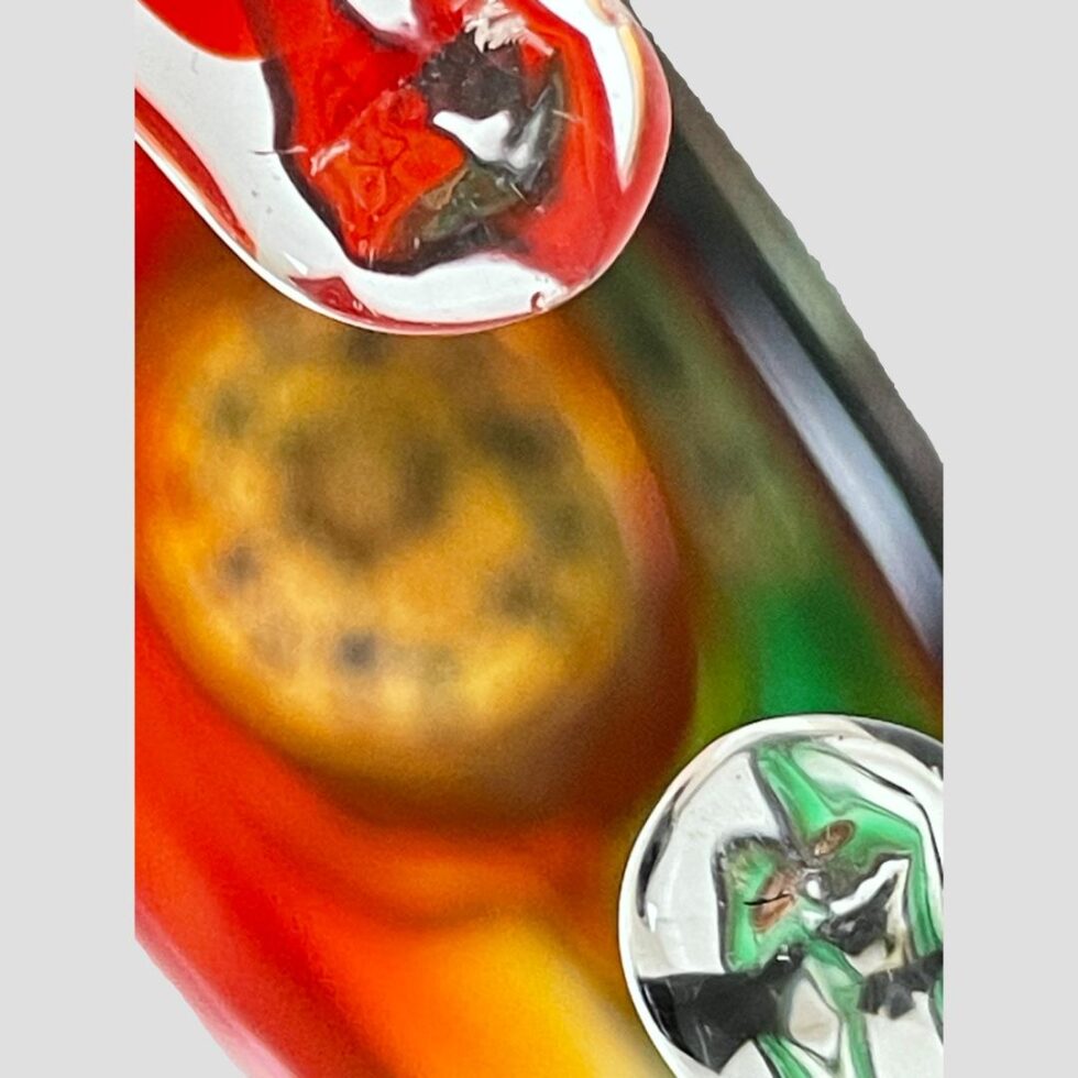 A close up of the rounded handle ends with the rest of basket in a blur.