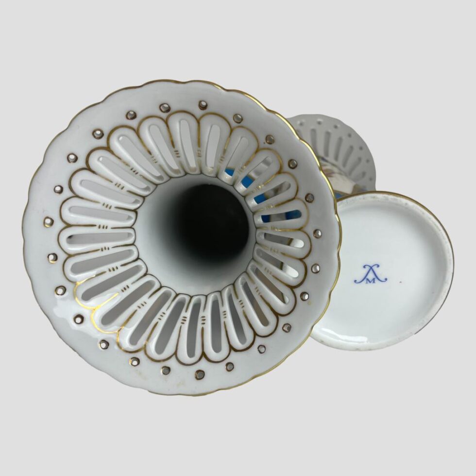 Photo of borh vases laid flat side by side with left side vase showing the perforated top area and the other showing the Meissen like (but not Meissen) marking.