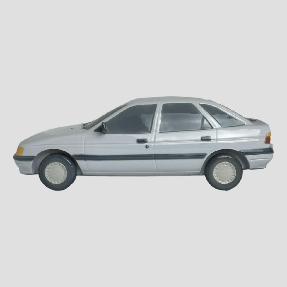 Photo of LLadro Ford Escort seen from a side angle with the car front on the left.