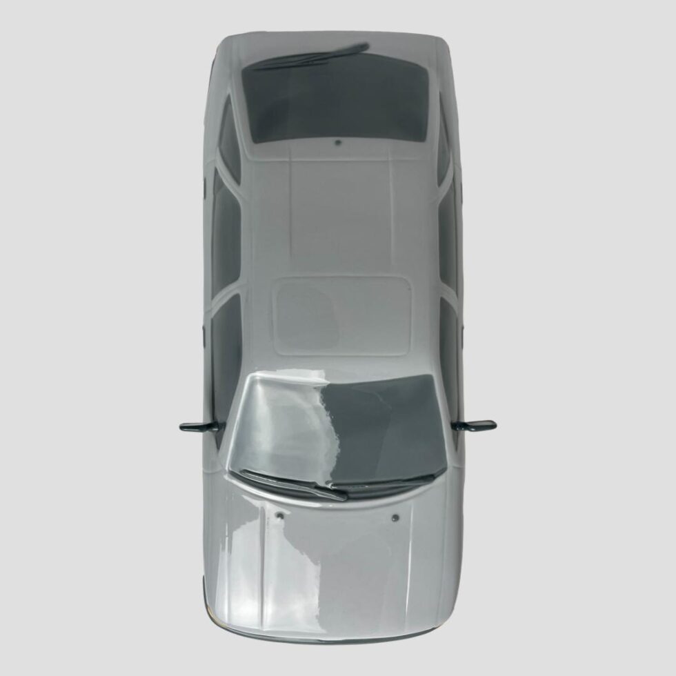 Photo looking straight down at the limited edition Lladro Ford Escort from above. The front of car is facing the centre.bottom