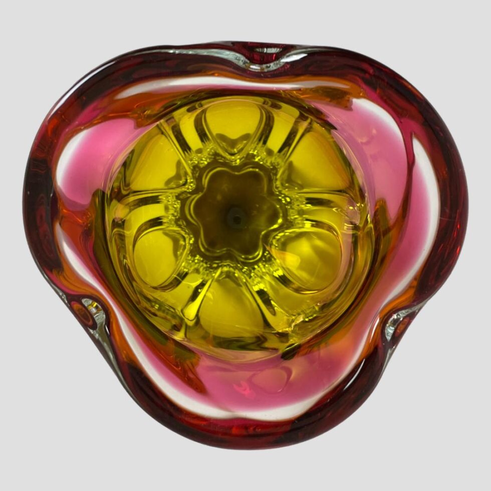 Photo looking straight down into the mouth of the Josef Hospodka vase. From this angle, it really looks like a tulip flower! Yellow in the middle and 3 pink 'petals'