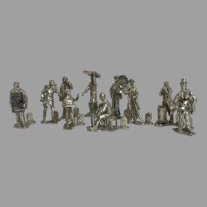 Main photo of novelty silver name/menu holders with 8 of the taller figures in a row at the back and the young match seller and seated cane chair restorer are in the centre foreground. It's great fun to go back in time to discover what street sellers actually sold as these tradesmen are now long gone. Each piece has been created with incredible attention to detail which we'll go into as we go on. Fantastic gift item.