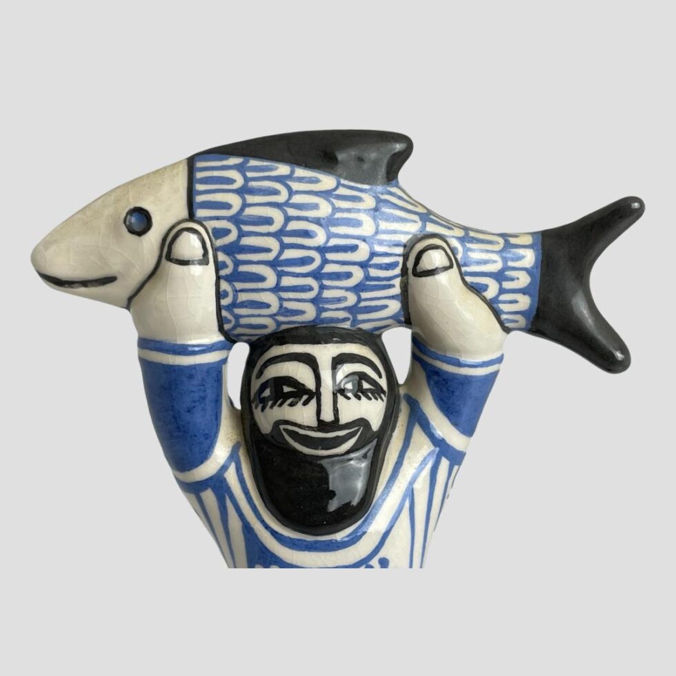 Close up of the fisherman from the chest up.