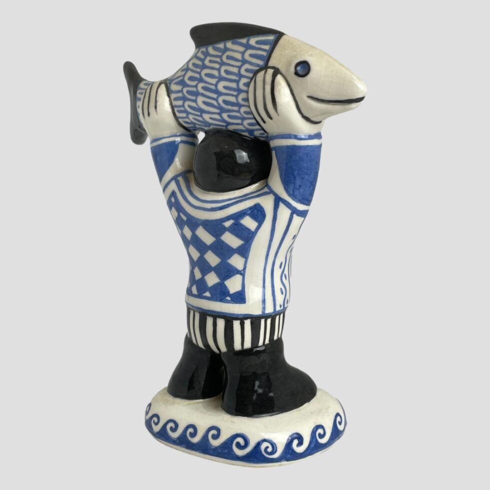 Photo of fisherman now facing the top right corner of photo.