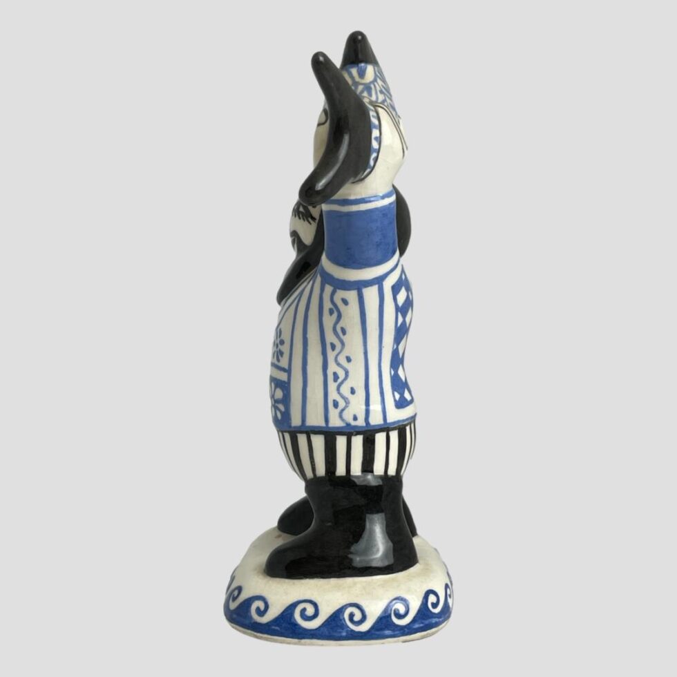 Side view of the fisherman showing his paunch in this one!