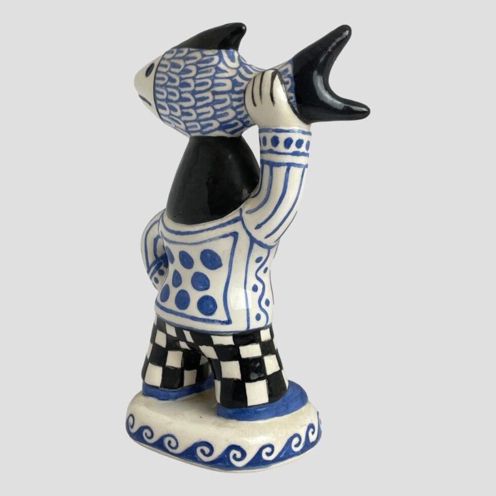 The fisherwoman is not facing top right corner.