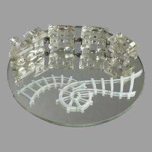 Main photo of Swarovski crystal train set displayed on the round mirror. The train and carriages are at the top of the round mirror while the white rail track which has a loop in it is seen below. The train engine is on the left with the 3 carriages attached via metal hooks and each piece is expertly crafted. A fabulous gift for the train enthusiast, Swarovski collector or 15th wedding anniversary (or anyone who loves pretty things!)