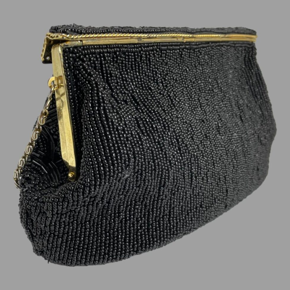 Photo of back of black beaded bag. This side has column upon column of small black beads.