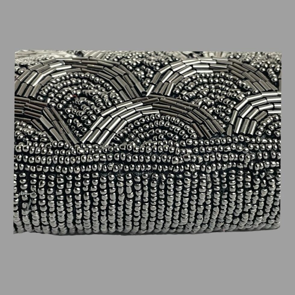 A close up photo of some of the bead work on the front of the bag. Incredible amount of beads for just a small patch on display!