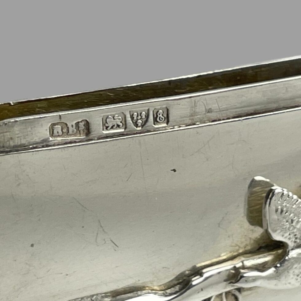 Close up photo of the full hallmark on the inside rim of case.