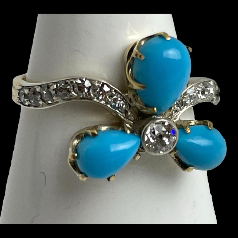 Close up photo of ring displayed on a cone shaped stand with the ring front facing a little to the right.