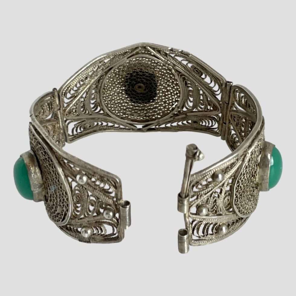 Photo of Egyptian silver filigree bracelet again displayed upright and this time showing the clasp undone.