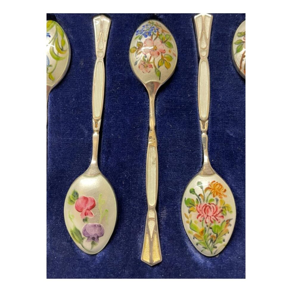 A close up photo zooming into the spoon with blemish to the enamel on the handle.