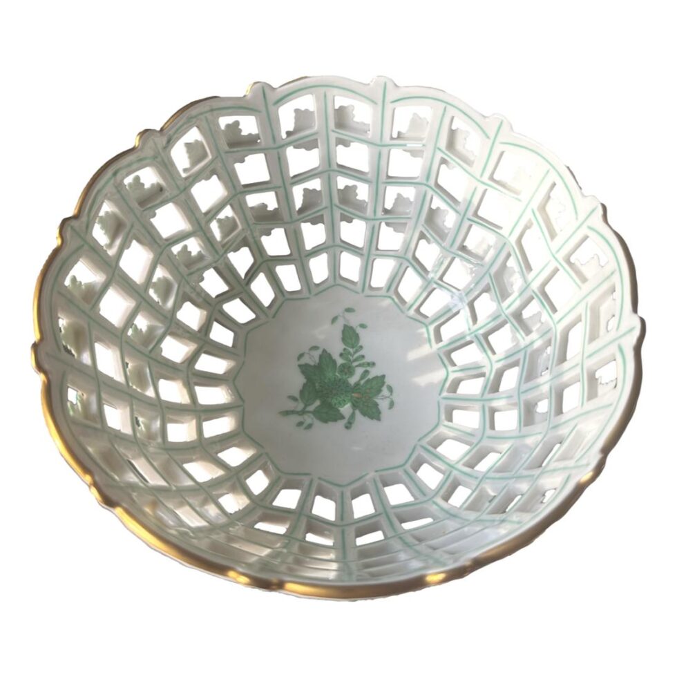 Photo looking straight down into the centre of the Herend lattice basket bowl. Hand-painted ivy detail can be seen in the centre.