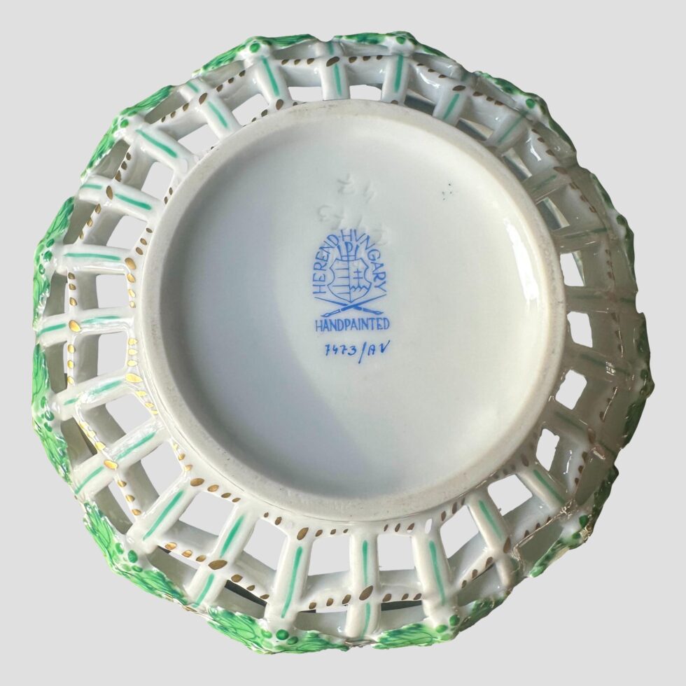 Photo of the base of Herend lattice basket bowl showing the Herend stamp in blue.