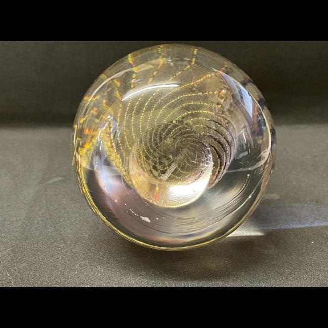 Photo of the egg laid flat displayed the small round flat area at base where the egg stands.