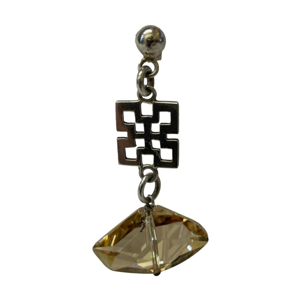 A close up of just one of the champagne quartz earrings still hanging.