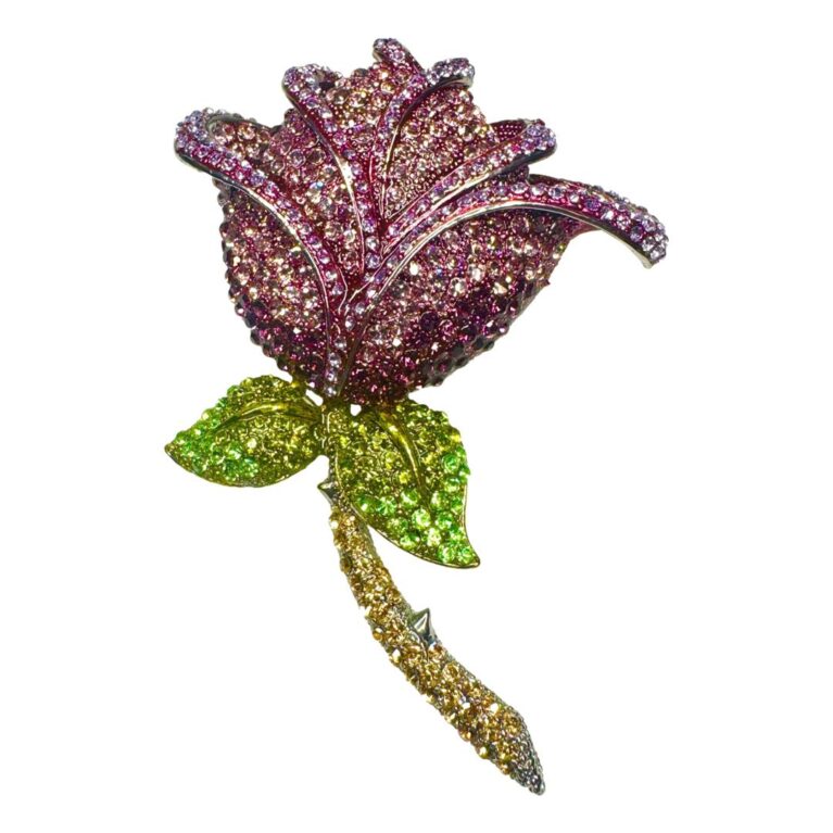 Main photo of Butler & Wilson rose brooch displayed with the brooch forward facing and the whole rose on show. This is a seriously blingy brooch with rhinestones galore from the red rose flower head, the green leaves and golden yellow stem. It has a nice subtle curve design and would fit nicely on a jacket or coat lapel pointing in towards the nose! Absolutely perfect gift item.